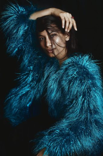 woman in blue fur coat